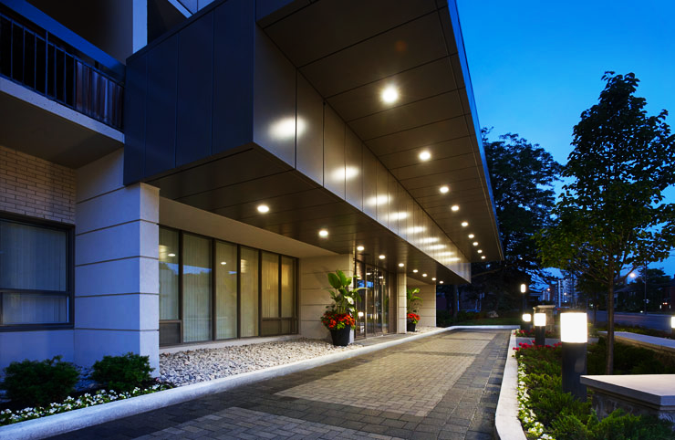 KG Group's Hampton House South Front Entrance at Dusk: Apartments for Rent in Midtown Toronto at 322 Eglinton Avenue East