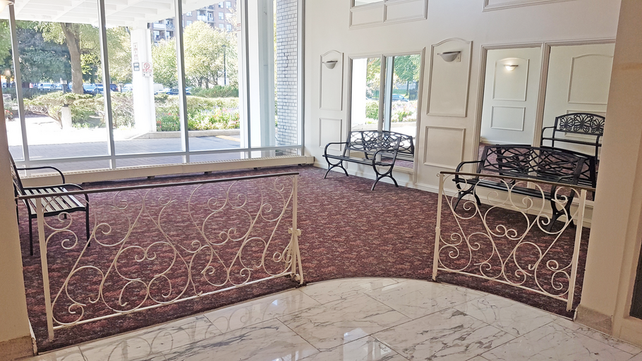 Bathurst and Sheppard apartment rental lobby lounge area with large windows and brown carpet Tags: