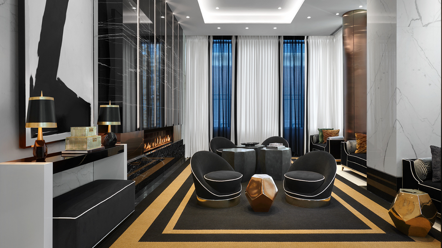 Luxury Midtown Toronto Apartments grand Lobby Lounge with elegant fireplace and plush, black seating.