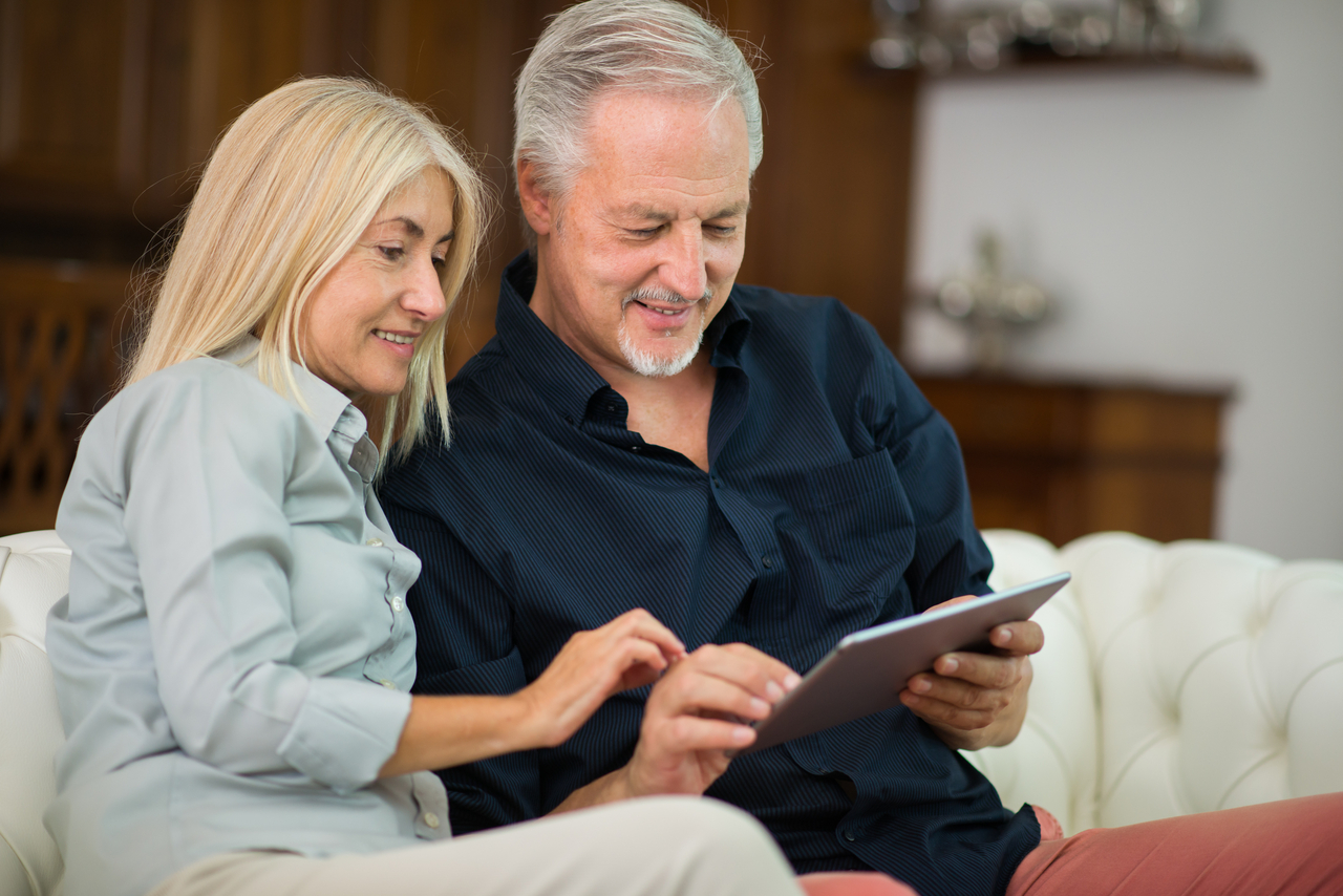 couple looking at harbour west pricing