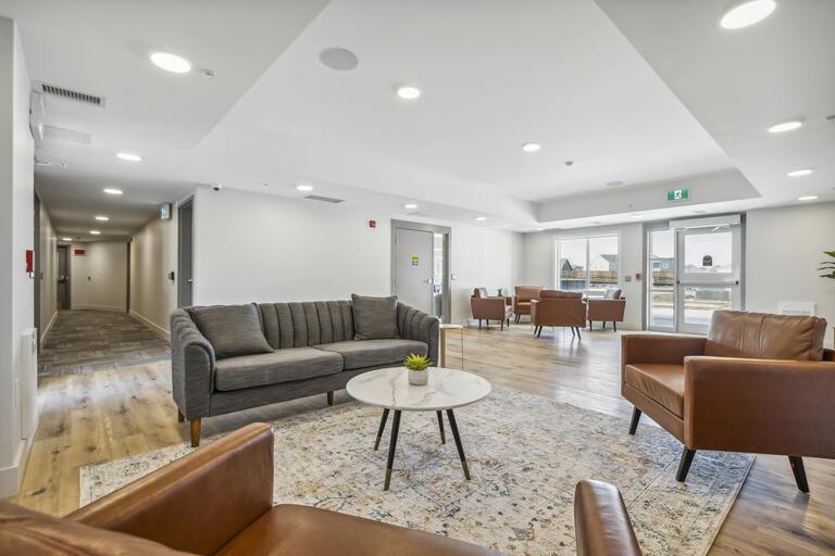 A spacious waiting room with a variety of seating options.