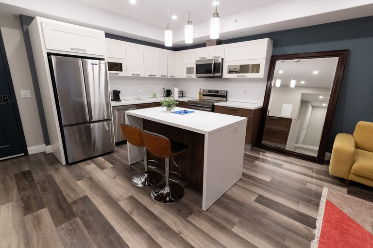Updated kitchen at 5971 Dorchester Road with sleek cabinetry, full appliances, and bright finishes
