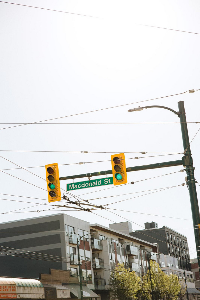 Girl at West 4th + Macdonald Street bus stop