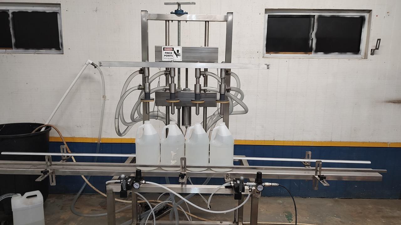 Neumann Packaging SO1A 4-Head Semi-Automatic Overflow Bottle Filling Machine, 2022 – Never Used