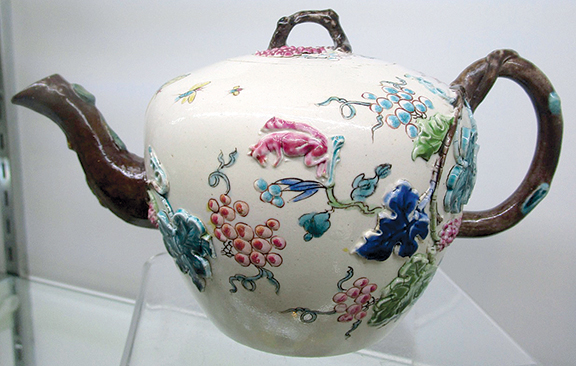 English salt-glazed teapot with polychrome enameling, with restoration to tip of spout and bottom of handle, $3300 from A.J. Warren of Maria & Peter Warren Antiques.