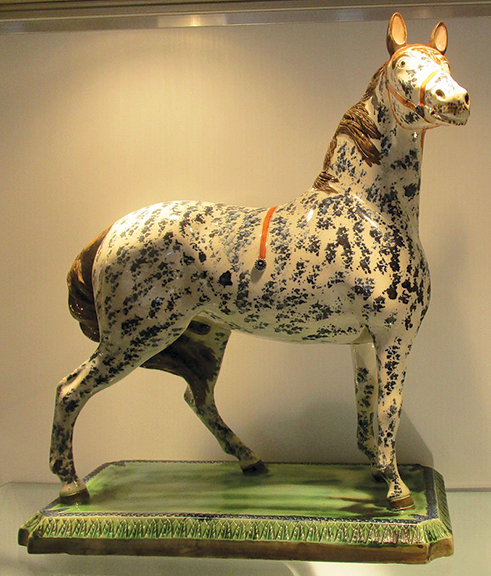 Alan Kaplan of Leo Kaplan, Ltd., New York City, asked $47,500 for this large circa 1800 sponge-decorated Leeds horse. It sold.
