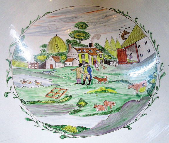 Martyn Edgell Antiques Ltd. from the U.K. offered this large Staffordshire bowl painted with a covered wagon on the exterior and a farm scene on the interior. It sold to a museum.
