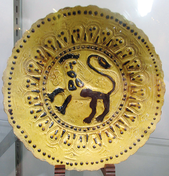 Garry Atkins of London asked $18,000 for this John Simpson slipware dish, which has been repaired.