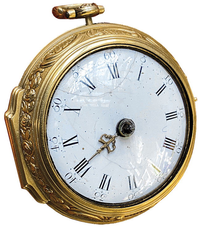 An 18th century Repousse watch with a gold outer cover