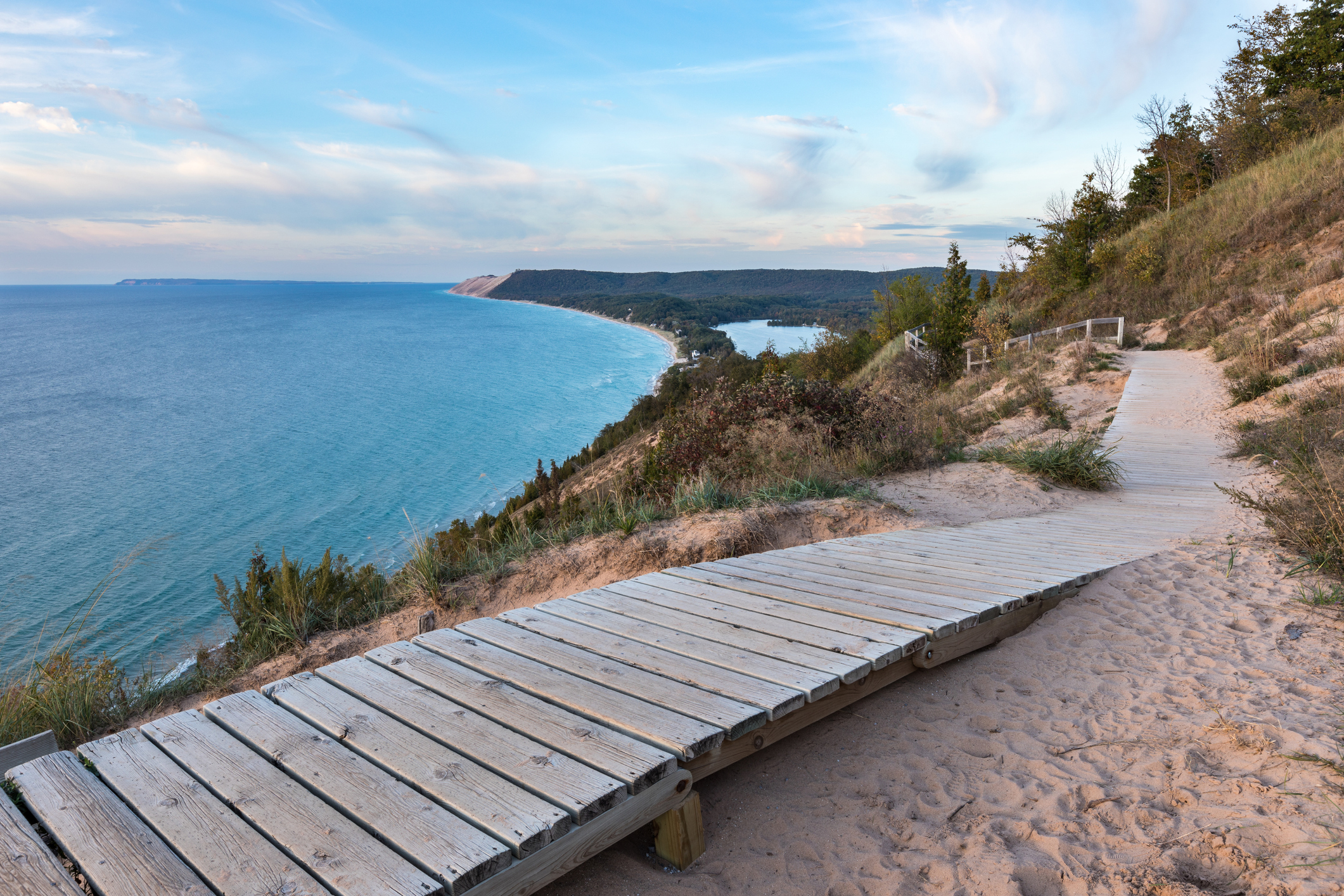 A weathered wooden walkway on the Empire Bluffs Trail is the perfect overlook to see Lake Michigan, the Sleeping Bear Dunes, and the Manitou island