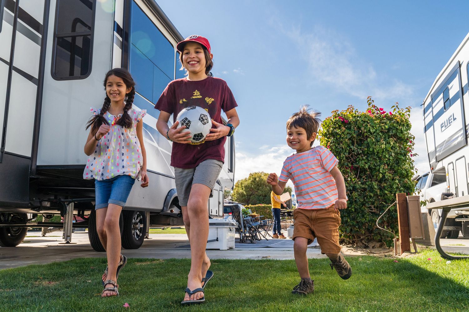 The Harbuck kids play and laugh while traveling by RV.