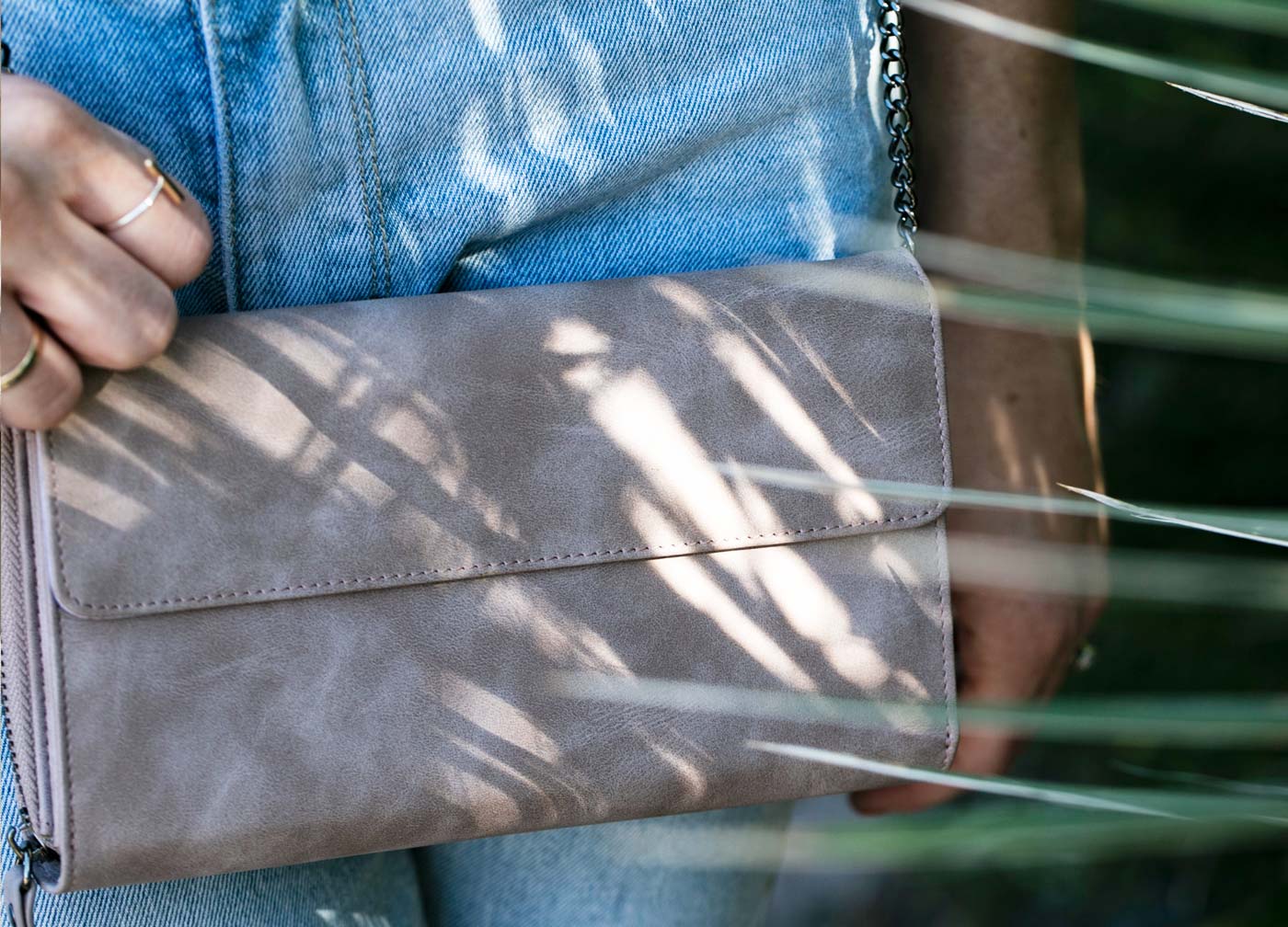 Maskcara model with Clutch Wallet in Dusty Lilac
