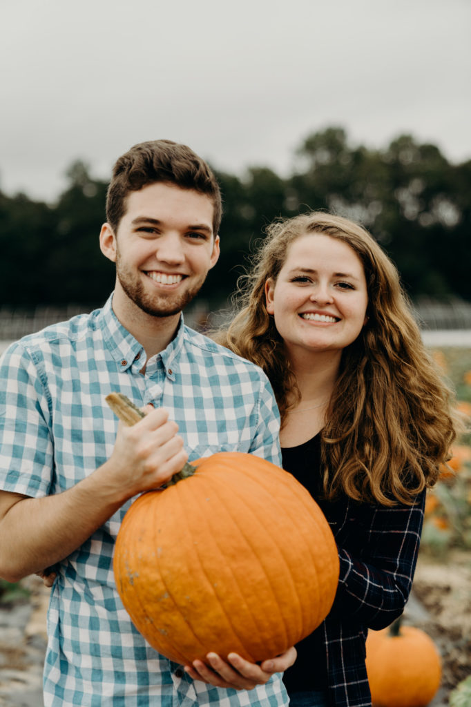 Fifers orchard couple with pumpkin