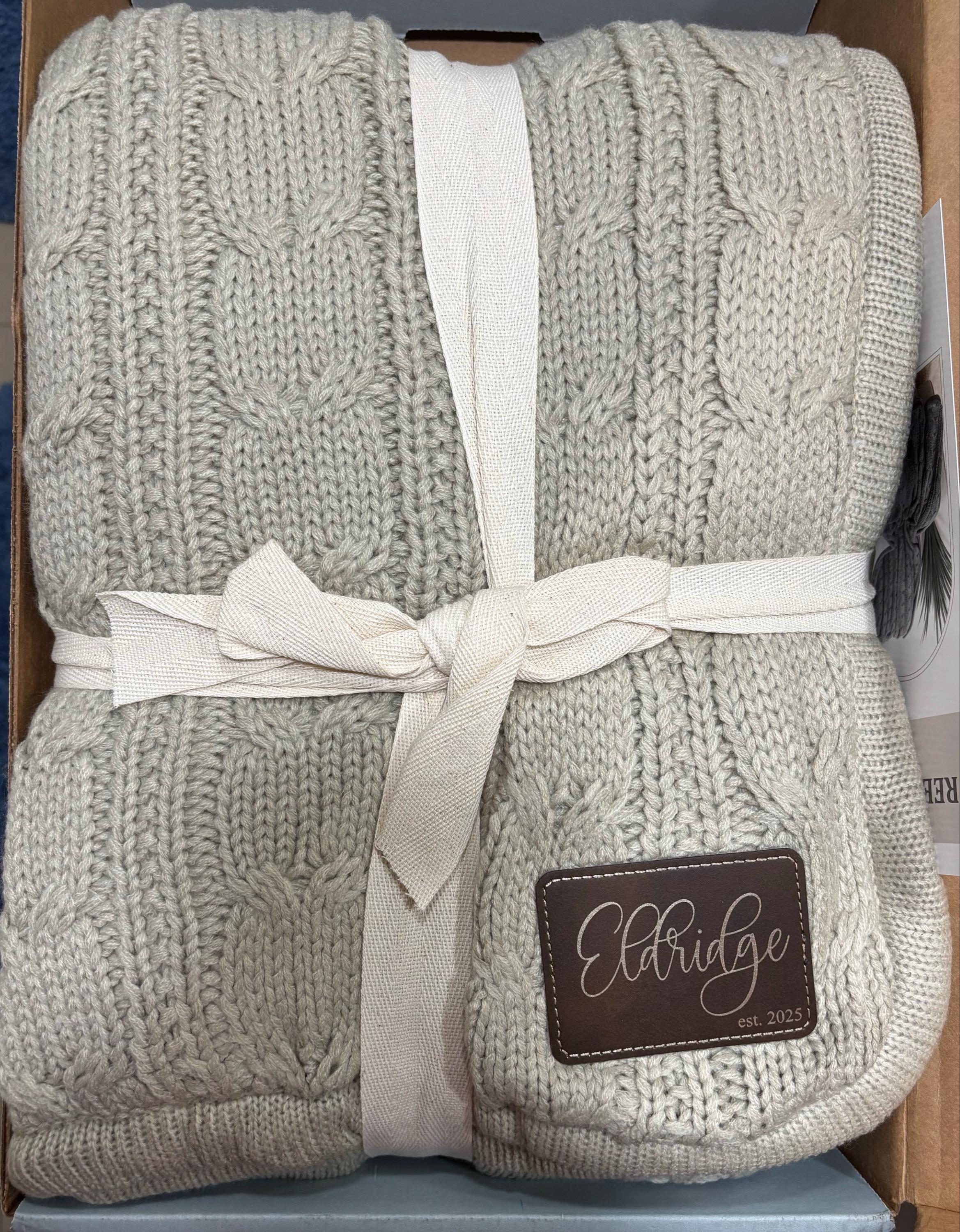 Customer photo of their cable knit blanket