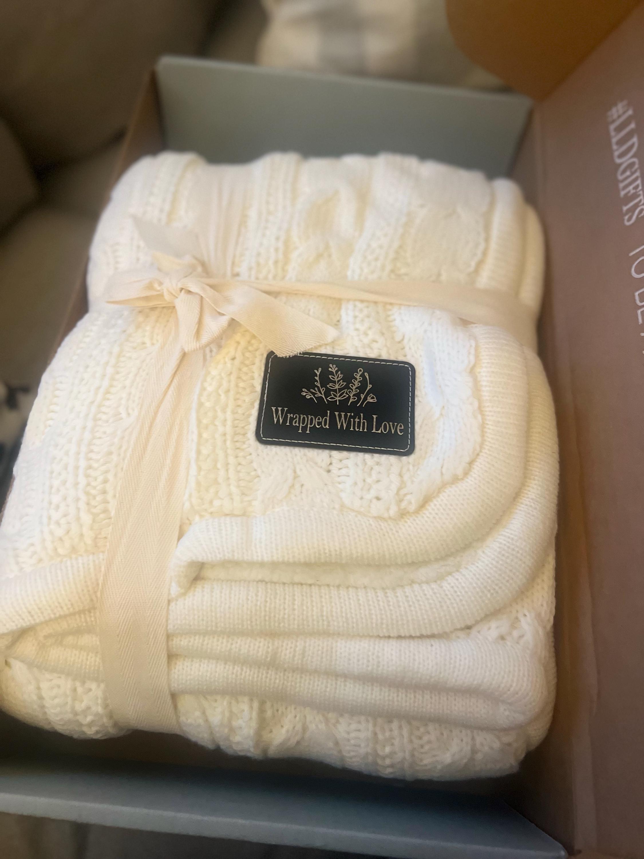 Customer photo of their cable knit blanket