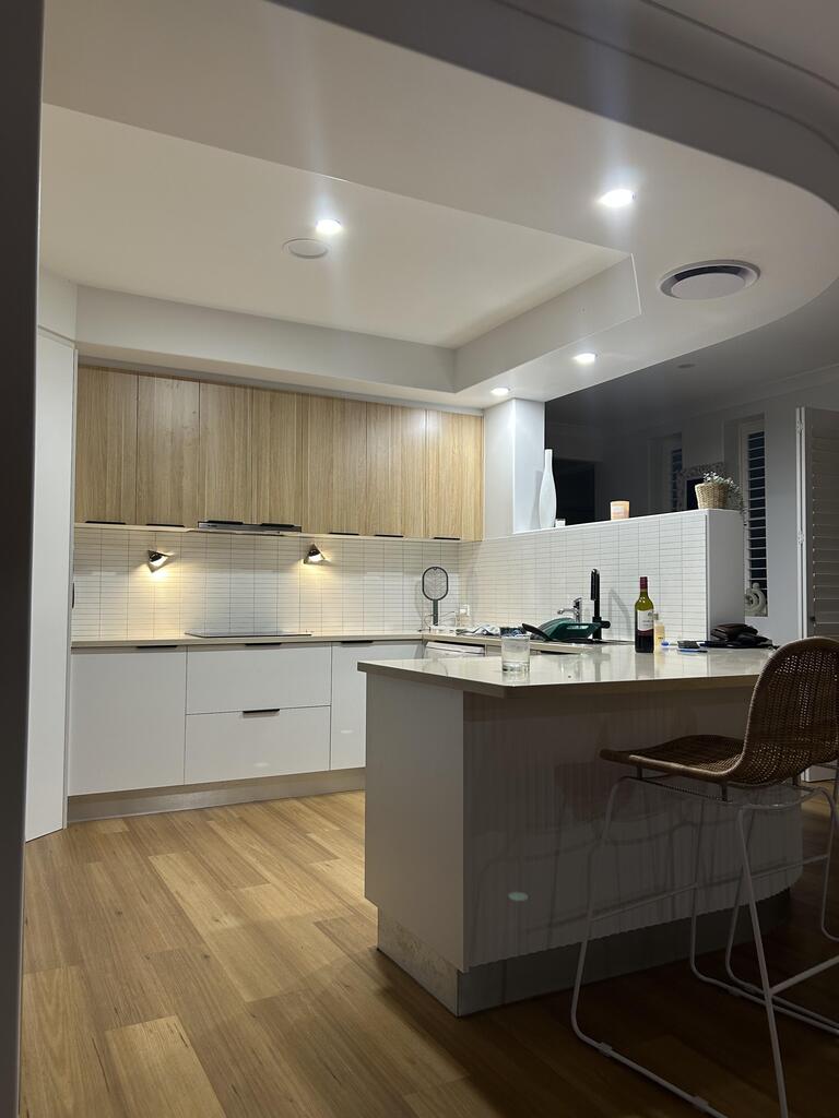 After: matte white Kit Kat composite tiles covering the glass splashback colour