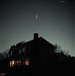 Iridium satellite number 35 lit up the predawn sky west of Boston at 5 a.m. EST on February 1, 1998, as Sky & Telescope senior editor Dennis di Cicco waited with his camera, taking a 10-minute exposure on Fujichrome 100 slide film through an 80-mm f/2.8 Hasselblad lens working at f/4.