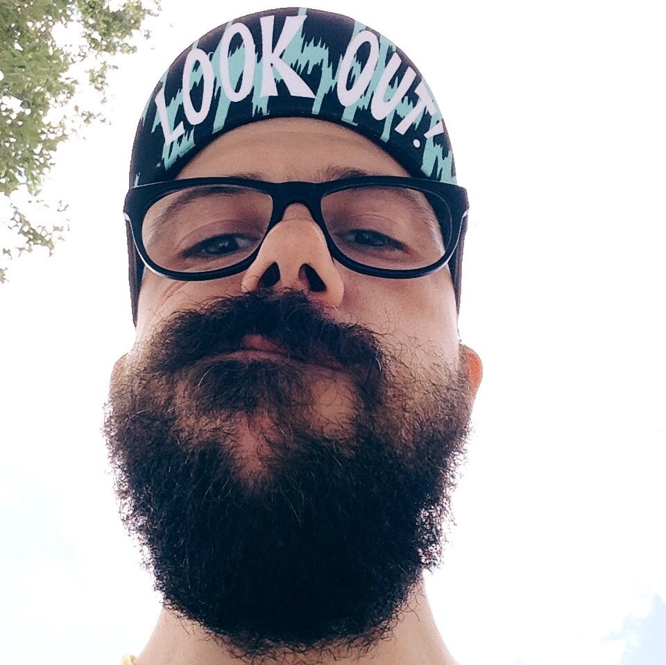 A very unprofessional photo of mike looking silly, with a superimposed photo of mike, again, looking up at the other face in admiration.