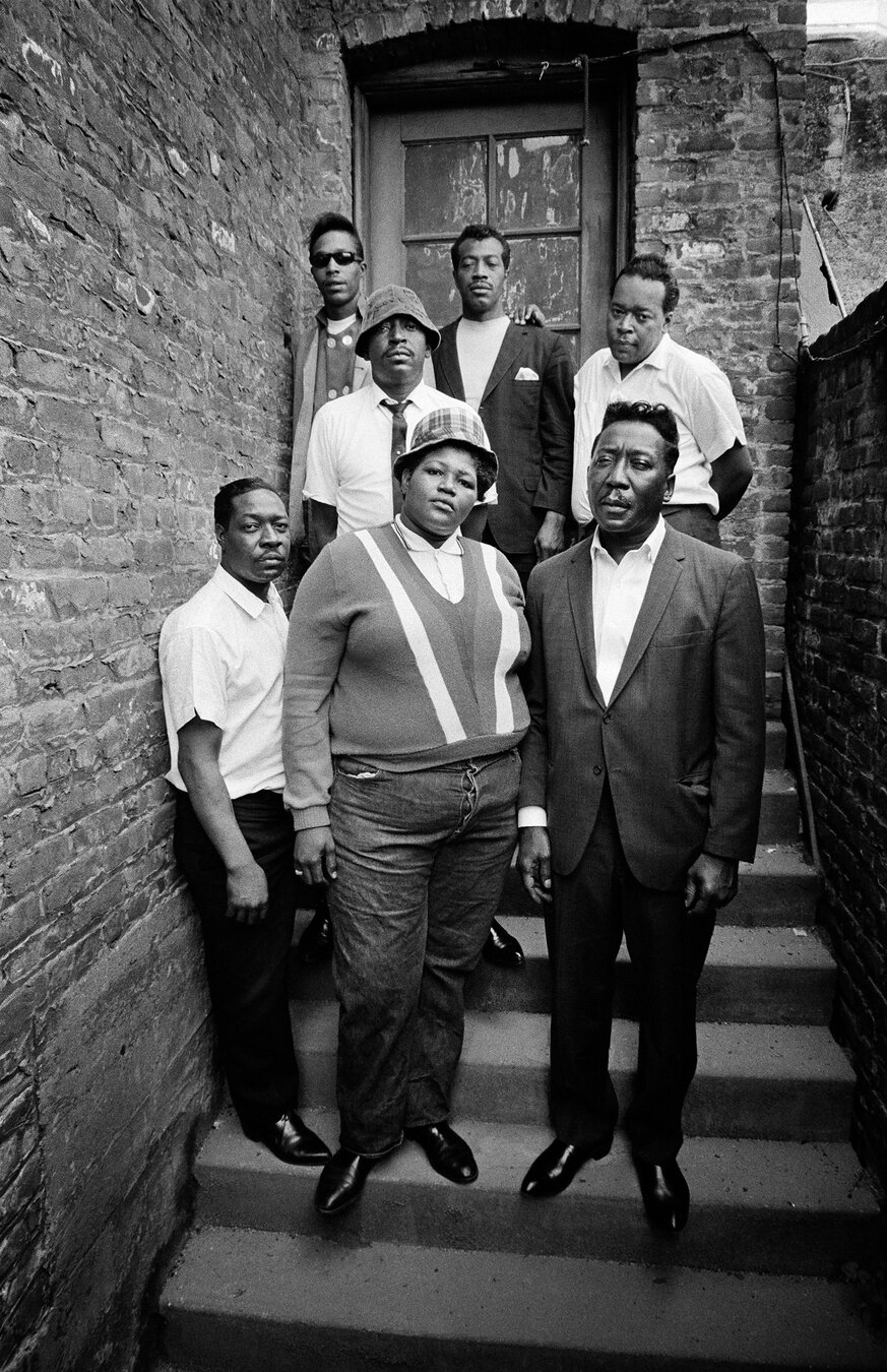 On the right-hand side of this slide, Big Mama Thornton is prominent in a group black-and-white photo with six members of the Muddy Waters Band posing on some steps. The seven band members face the camera, with Thornton and Waters in the front on the bottom steps.