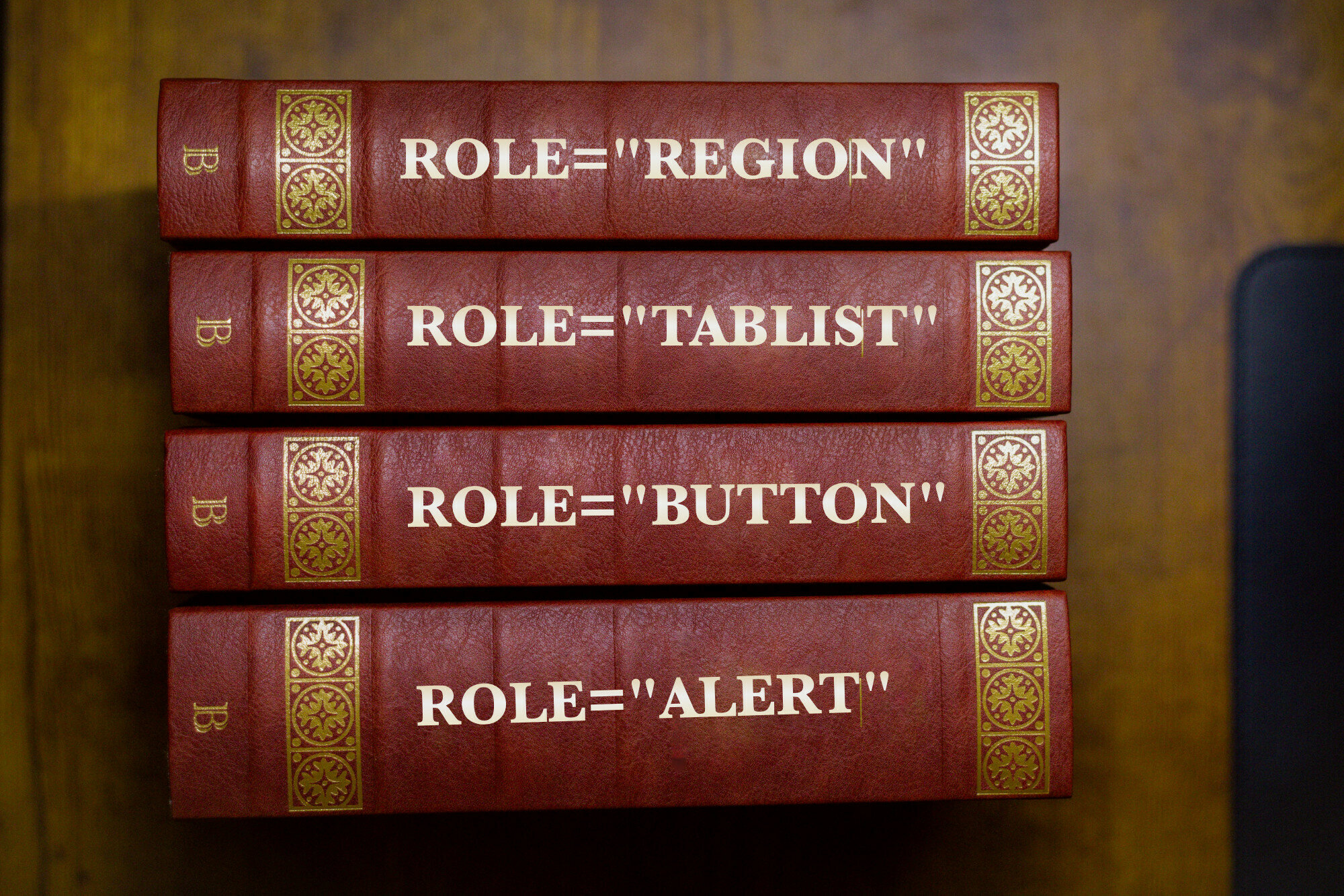 A set of old looking encyclopedias except the text on the spines hav been replaced by "role=region", "role=tablist", "role=button" and "role=alert"