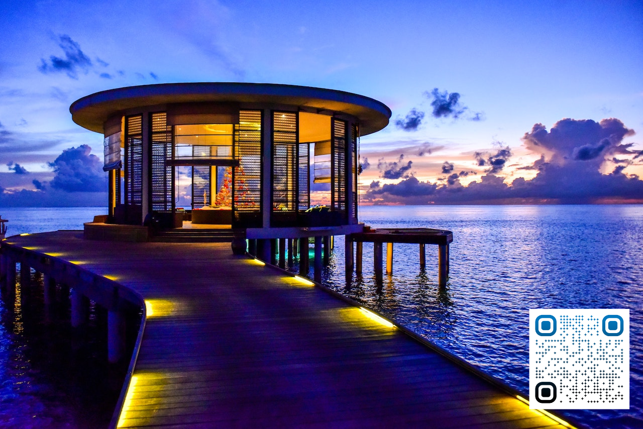 Beautiful Airbnb outdoor living area on a deck above water. Owner used an airbnb calculator to estimate income before buying