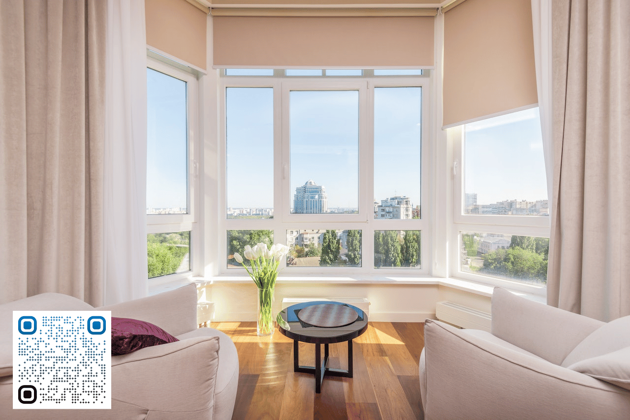 Sunroom with large windows overlooking the city from above. This Airbnb is a top income performer