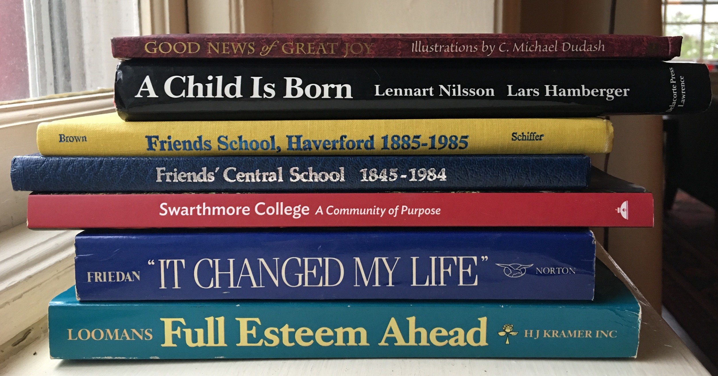 photo showing a stack of books with spines facing the viewer