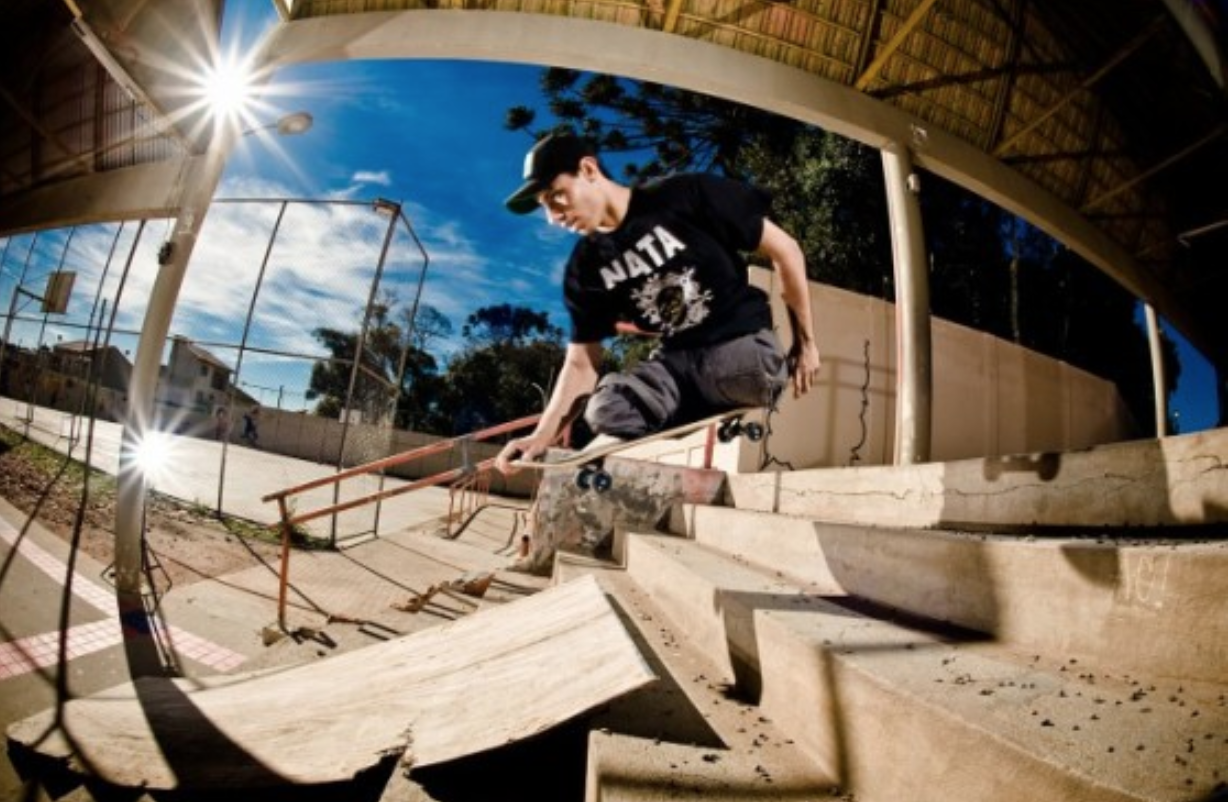 Disabled skateborder Italo Romano soaring over a short flight of stairs