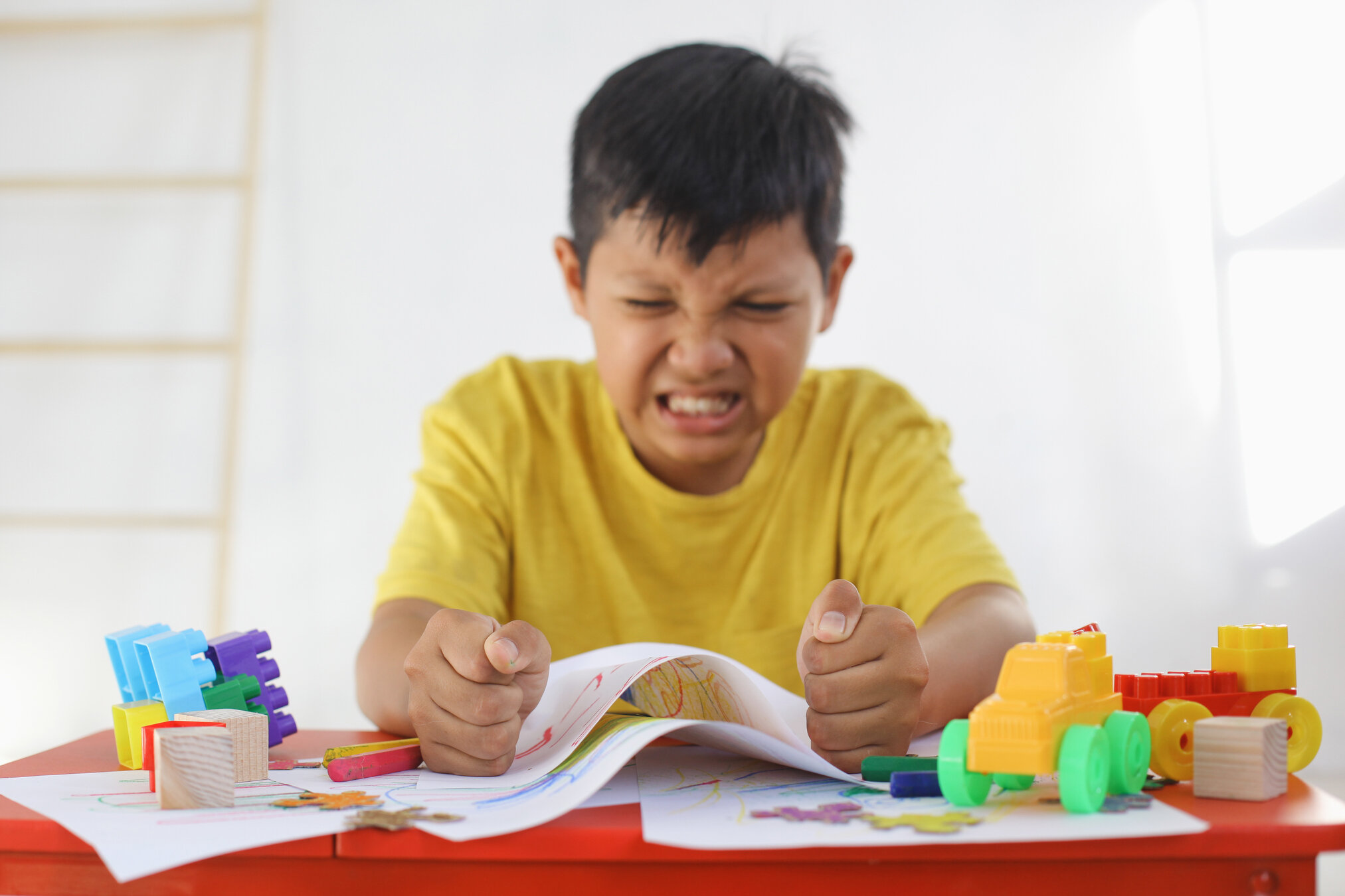 boy clenching fists in anger