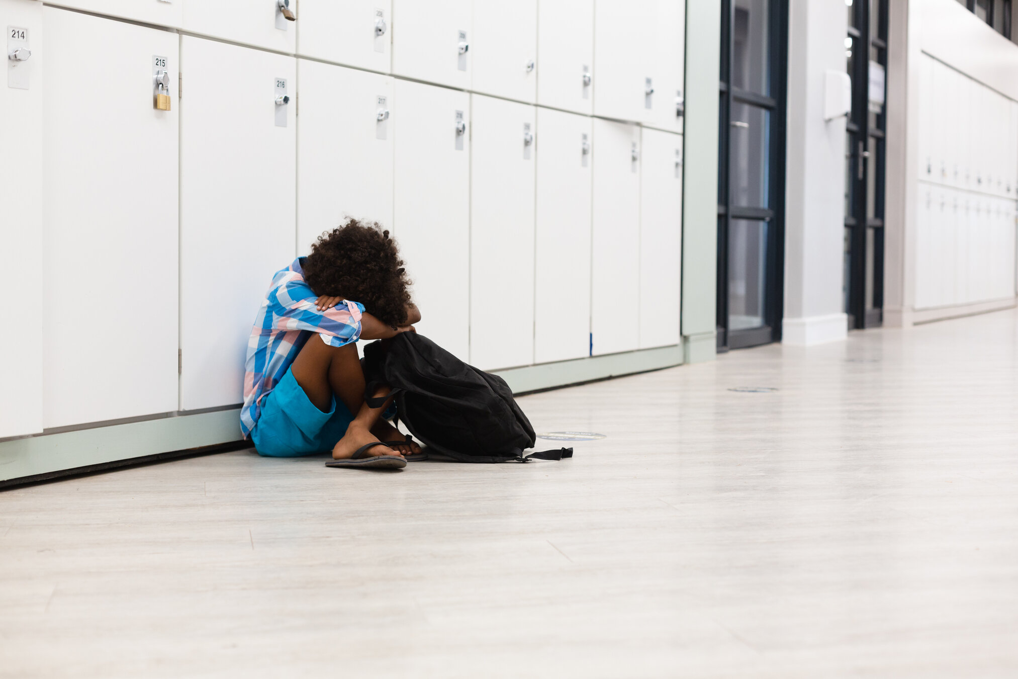Student sitting with head down
