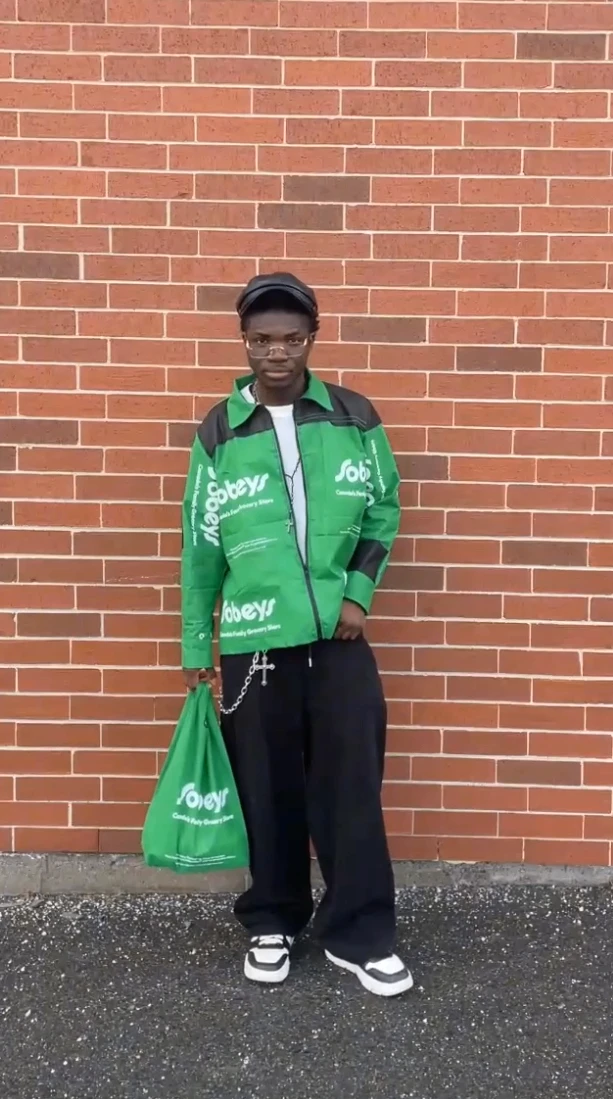 Vertical perspective of a skyscraper against a blue sky