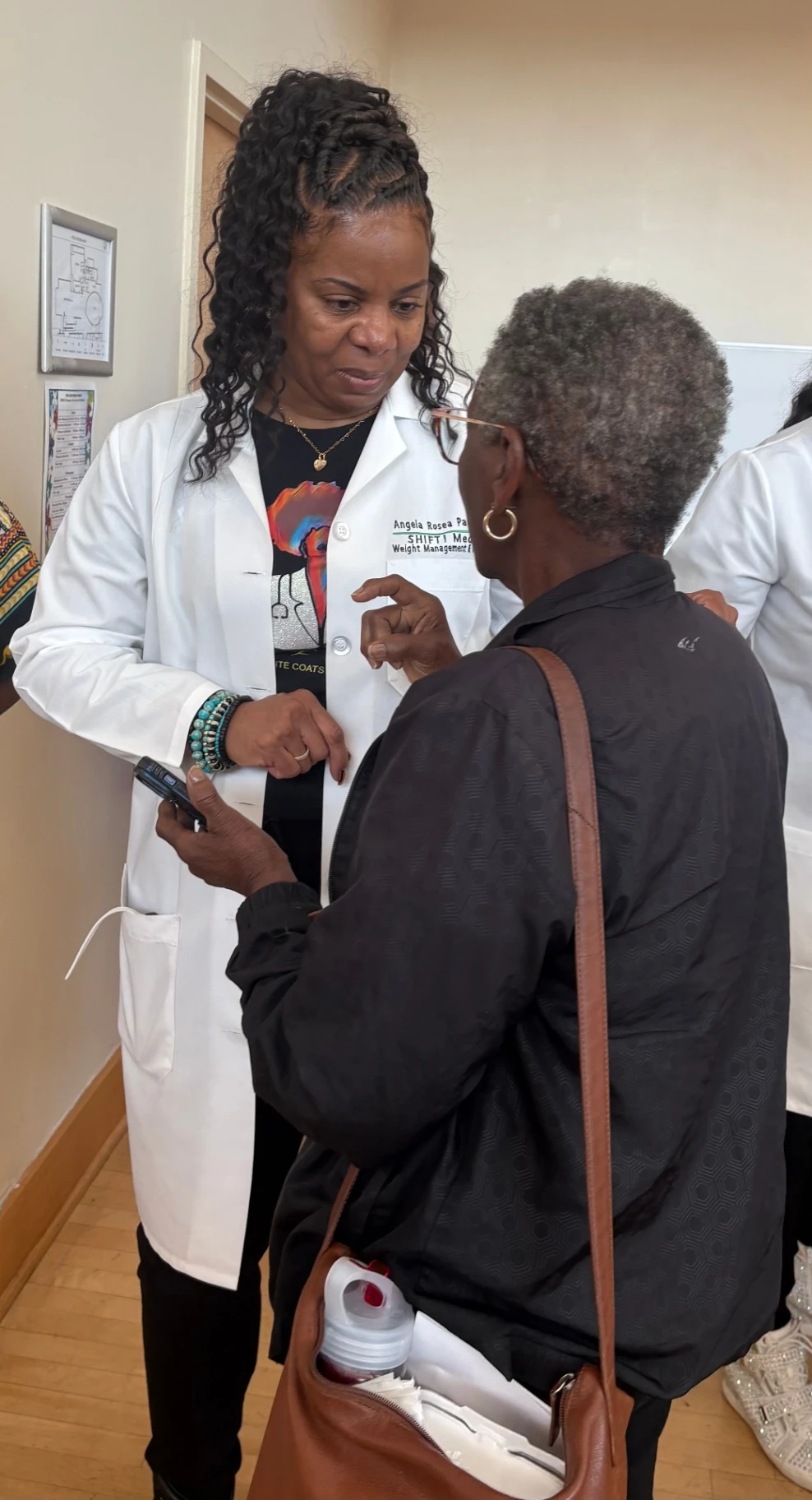 Diverse community members interacting with caregivers in a warm, supportive environment