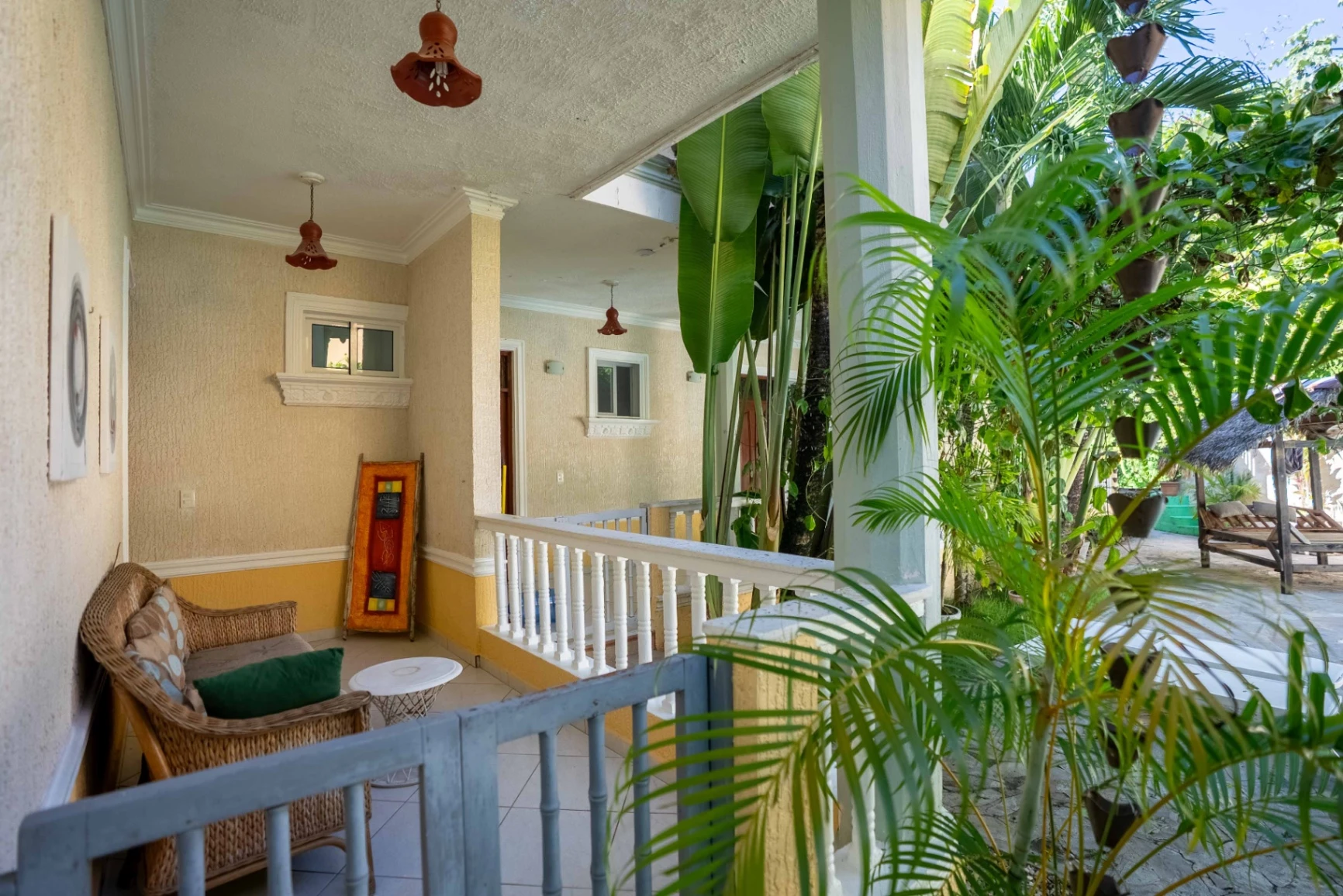 Palm tree swaying in wind against blue sky