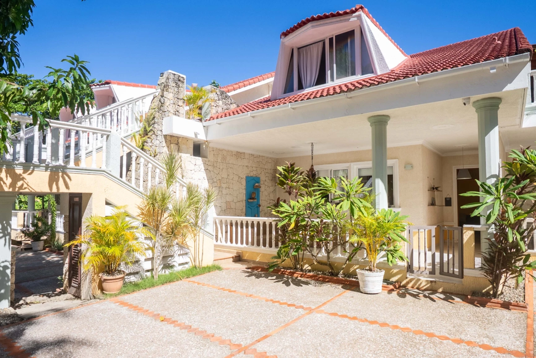 Surfer walking towards the ocean at sunrise