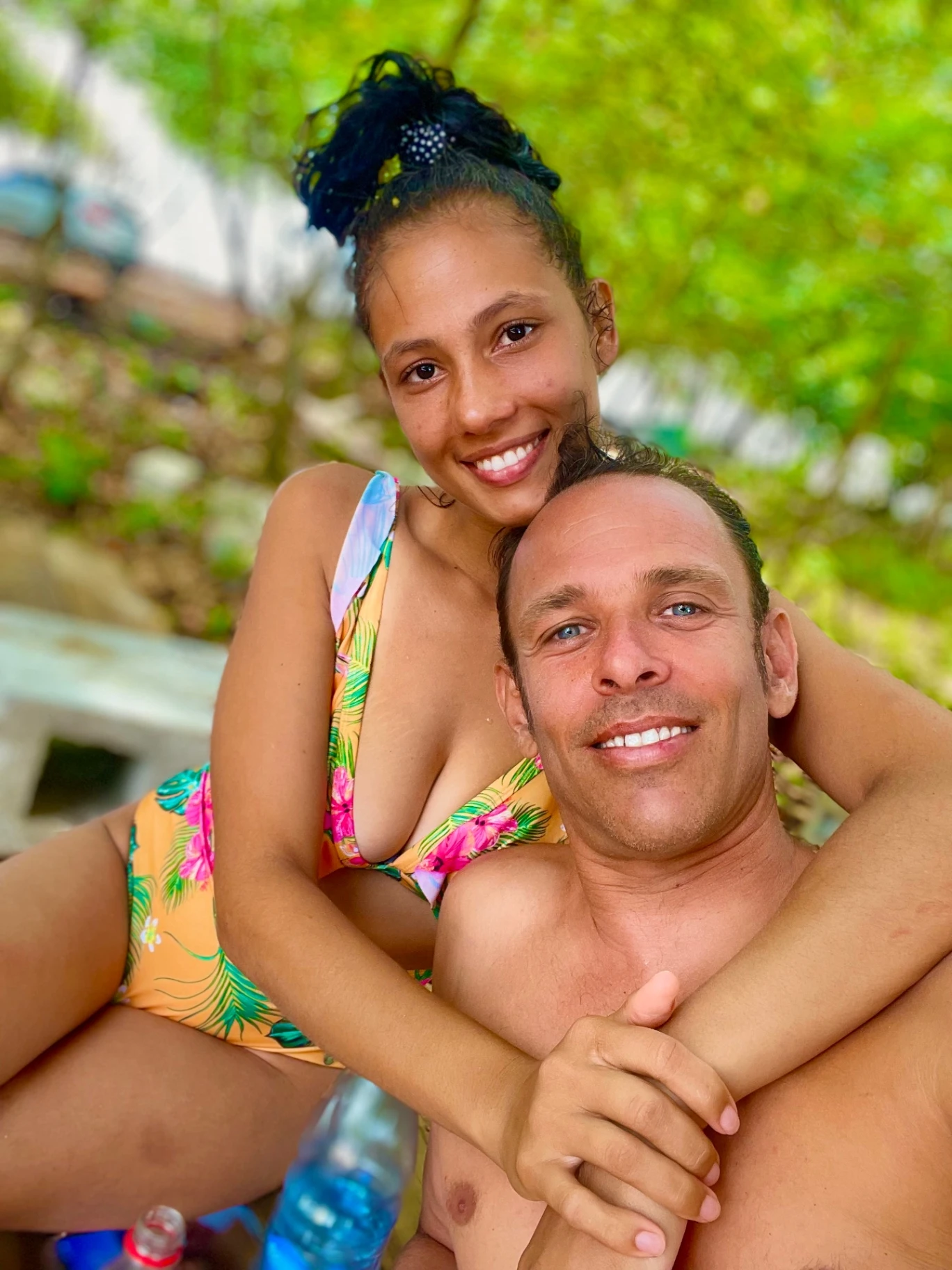 Surfer walking towards the caribbean sea
