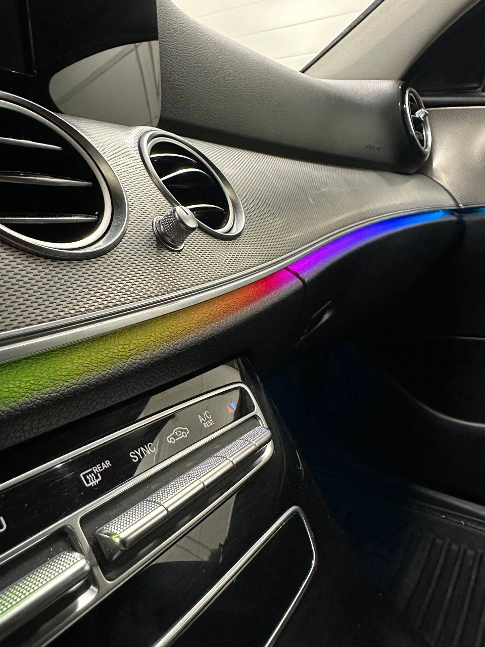 Premium car interior with custom ambient lighting and trim