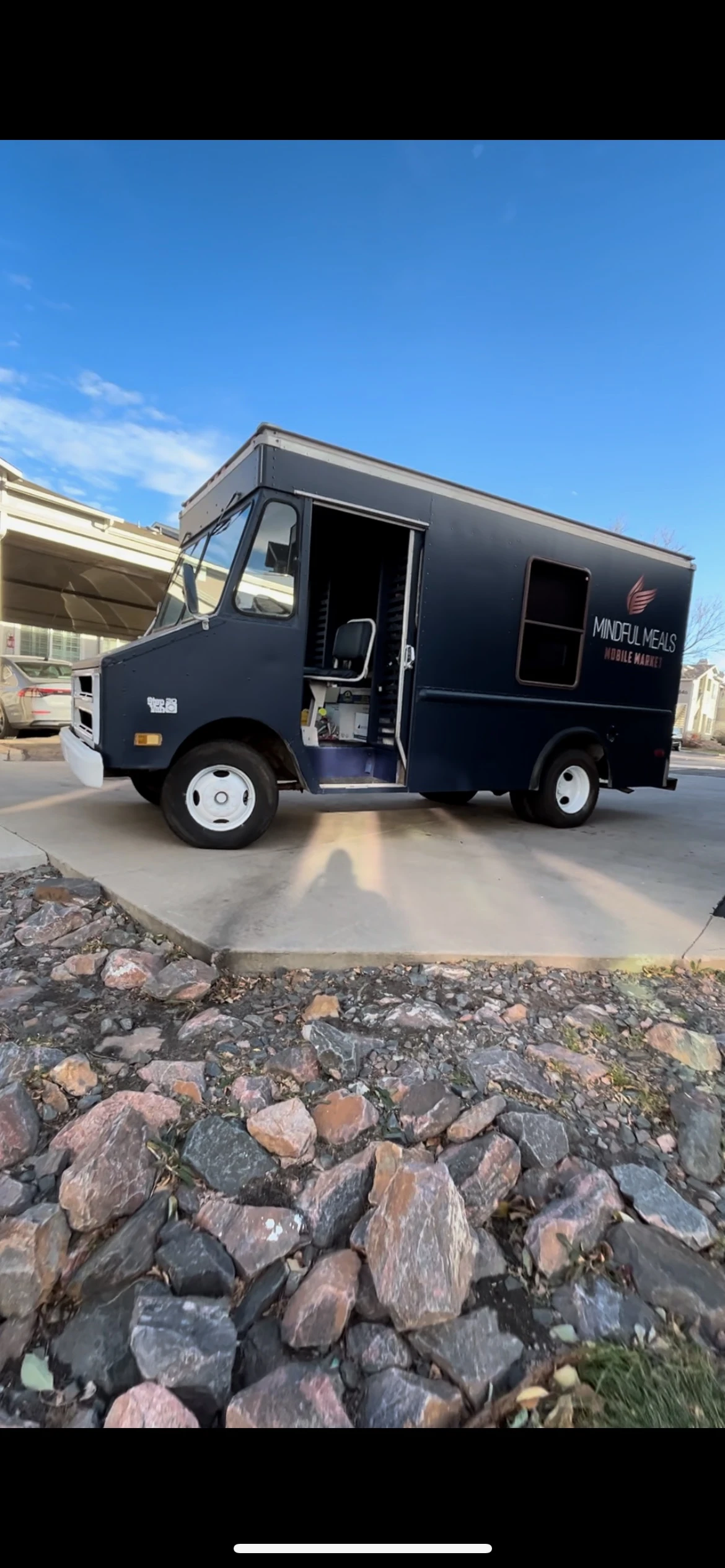 Healthy living mobile market truck arriving at a local hub
