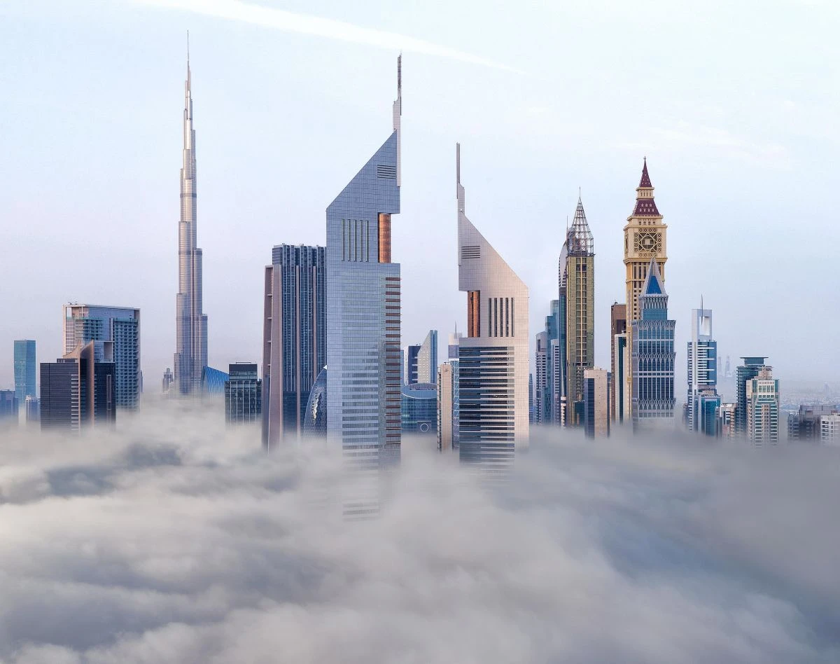 Emirates Towers and Dubai Skyline in Clouds