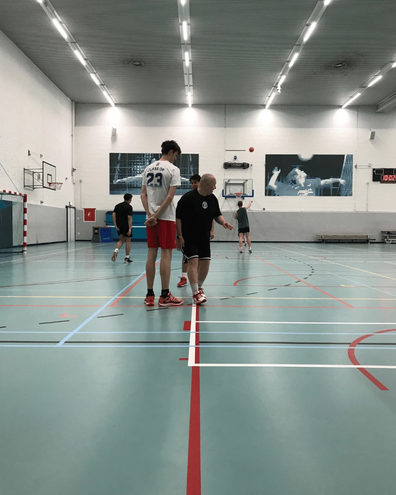 Player and coach analyzing film