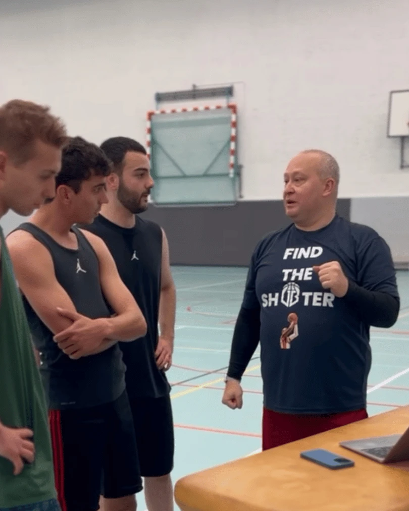 Coach and player conducting film analysis