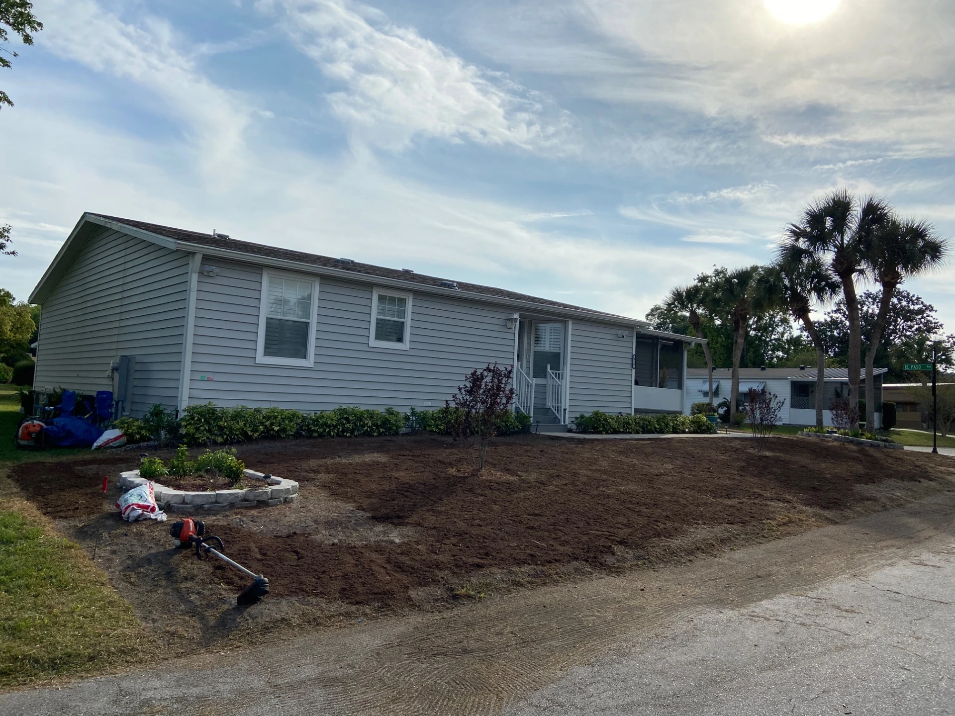 Professional sod installation team preparing soil