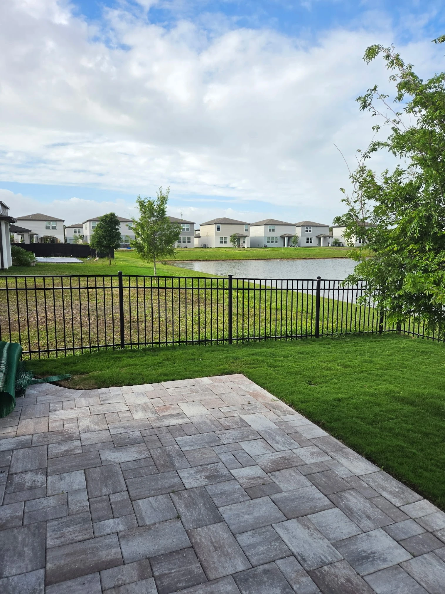 Wide panoramic view of a completed riverside landscape project