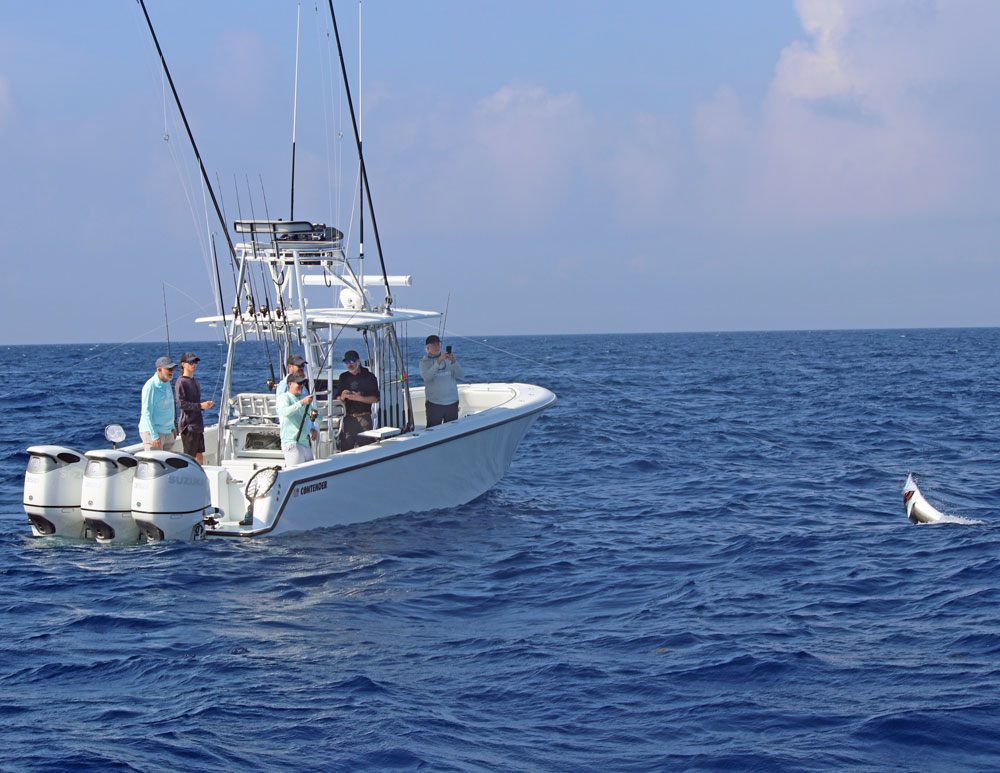 Anglers Journal editor Charlie Levine fights an Atlantic sailfish with a Penn spinning combo.