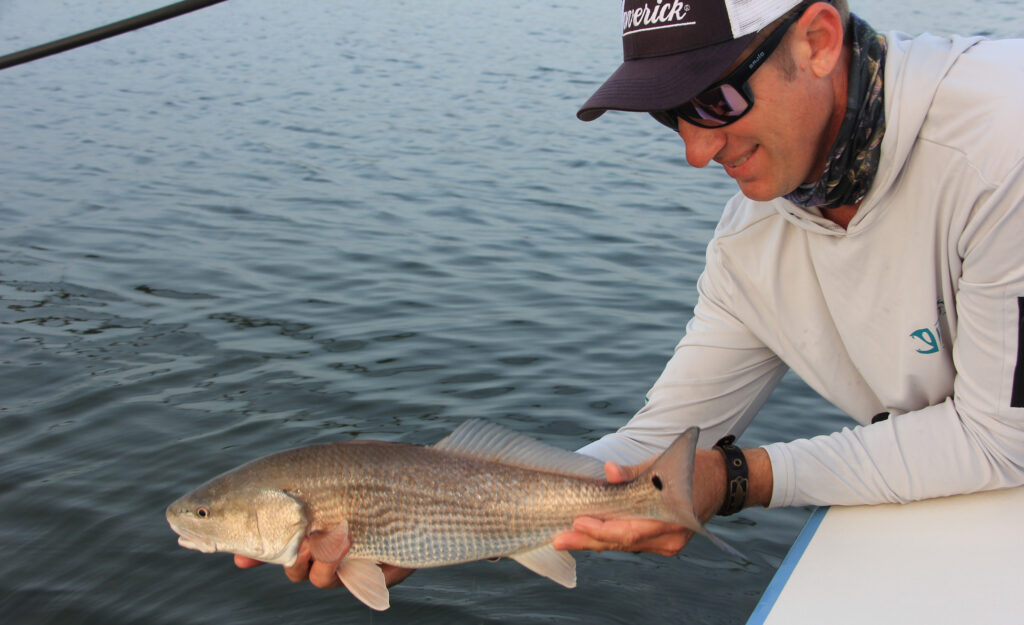 Capt. Tommy Derringer with a Florida redfish