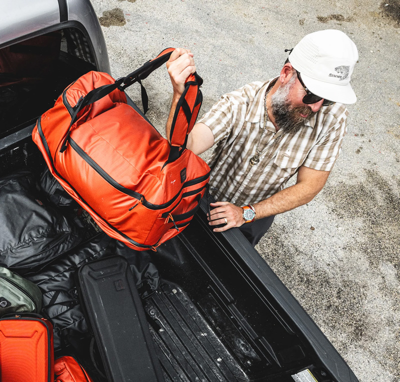 The Simms Tailwind Duffel is roomy and protects your gear.
