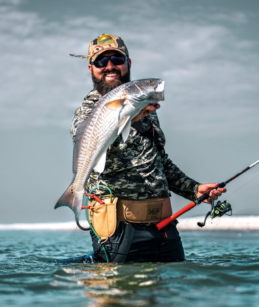 Theophile Bourgeois with a beautiful redfish caught at the Chandeleur Islands