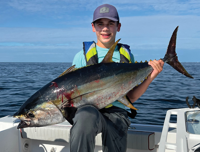 Young angler catches yellowfin tuna