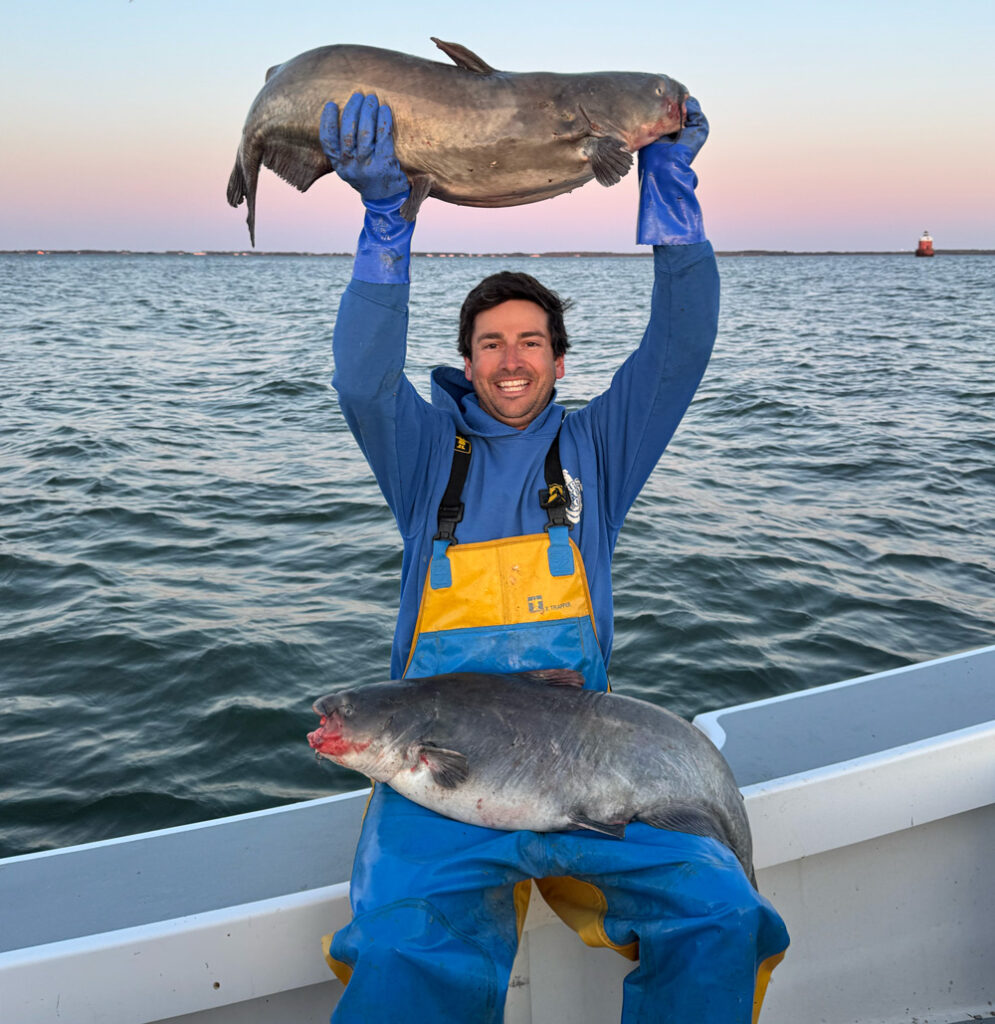 Photographer Jay Fleming with catfish