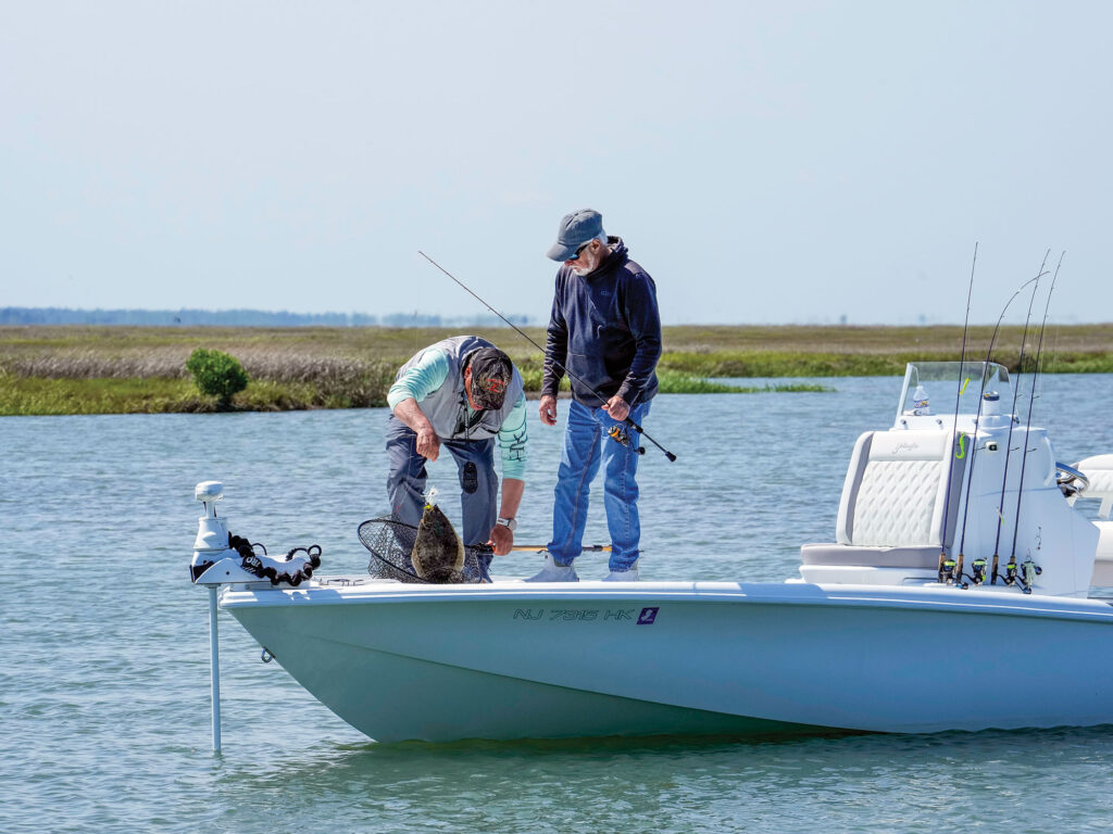 Anglers with a fluke on their boat