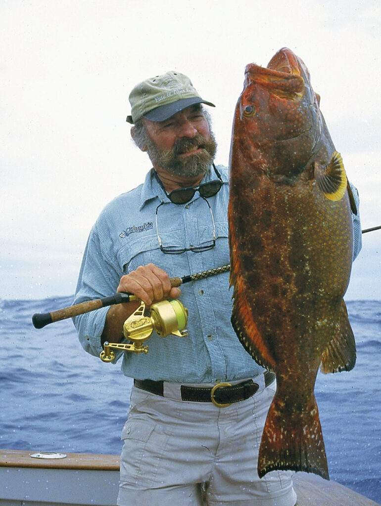 Flip holding up a large fish